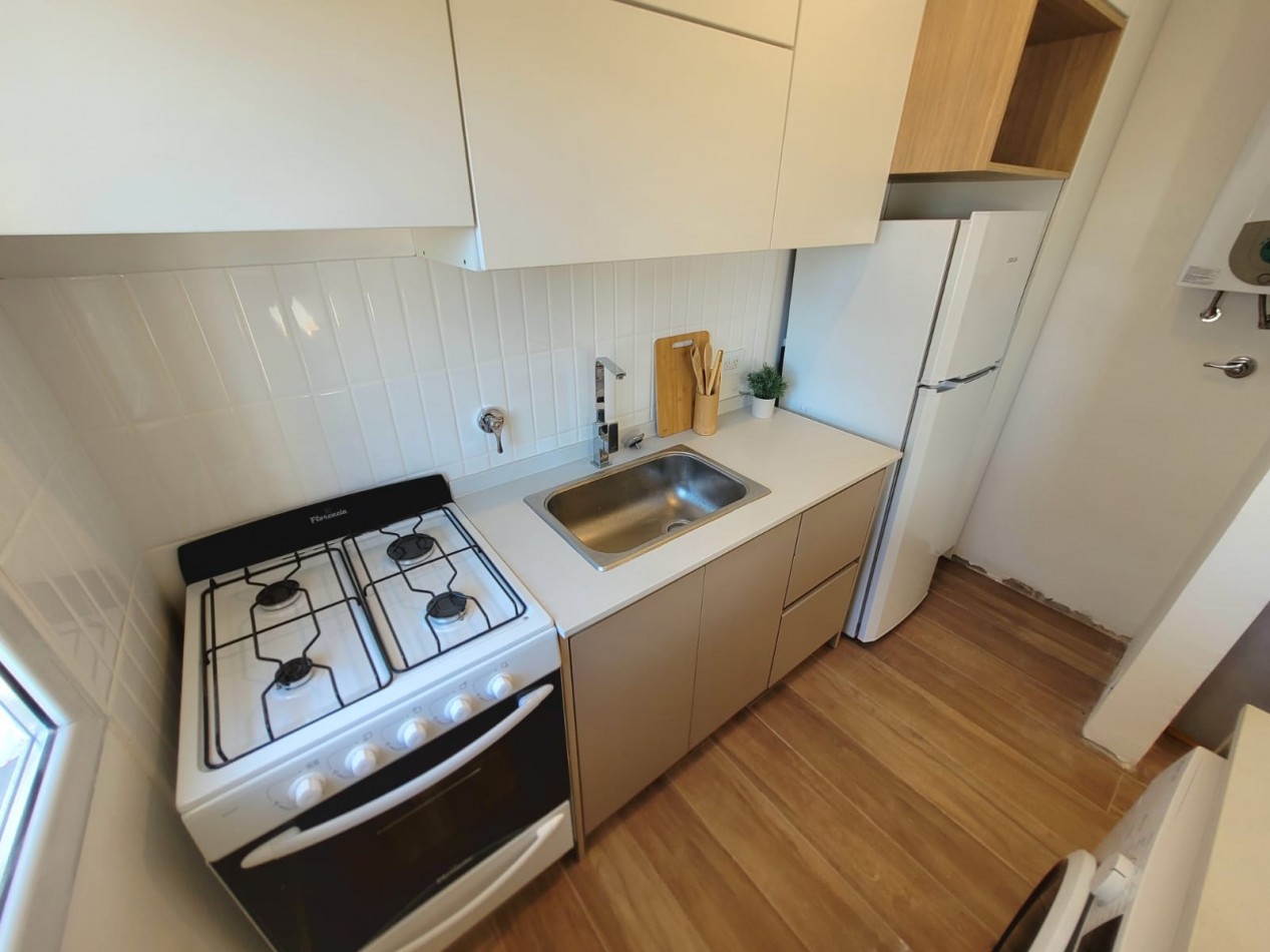 Departamento dos ambientes con espacio de cochera